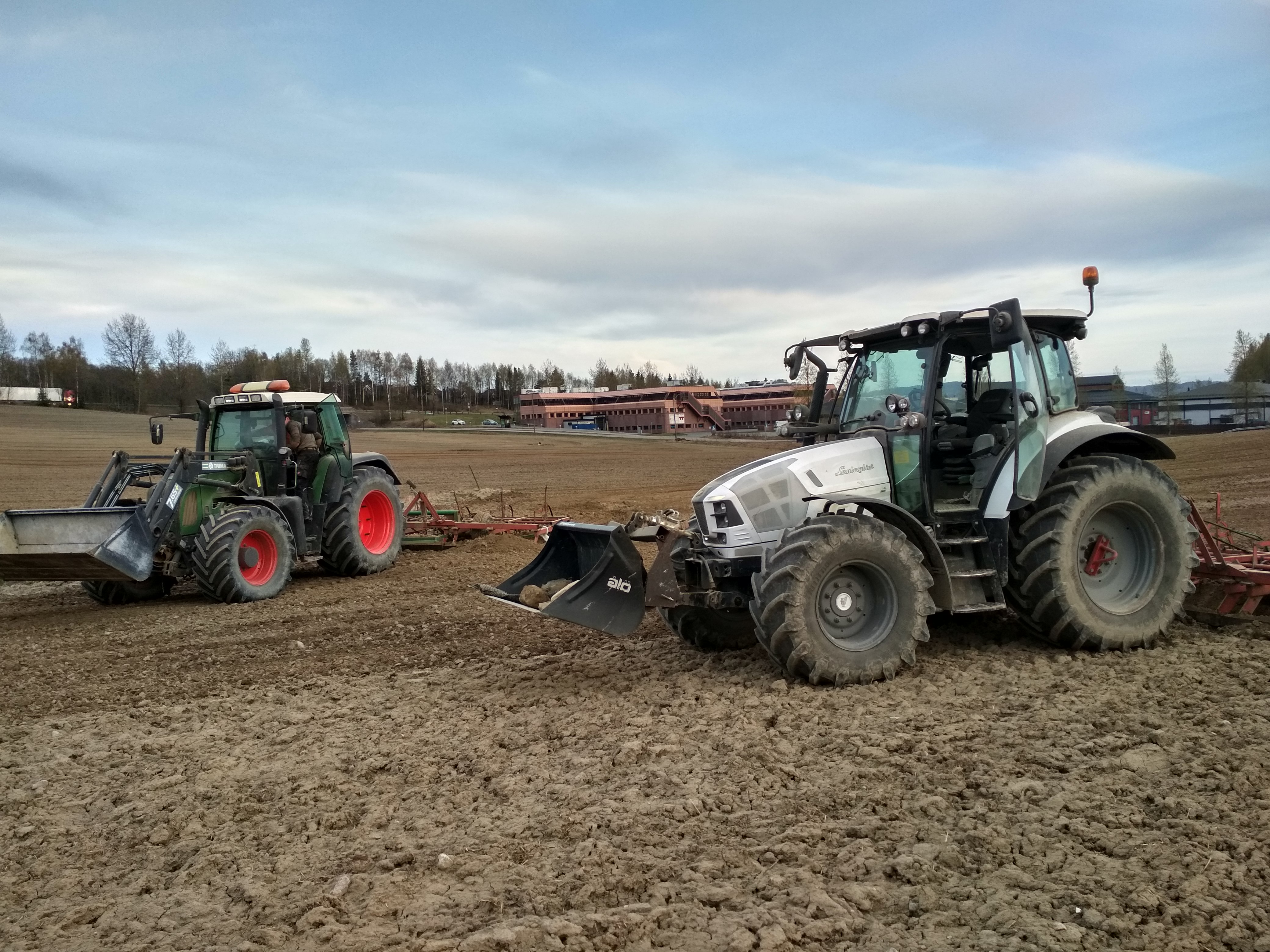 Two tractors working in field on Norwegian grain farm